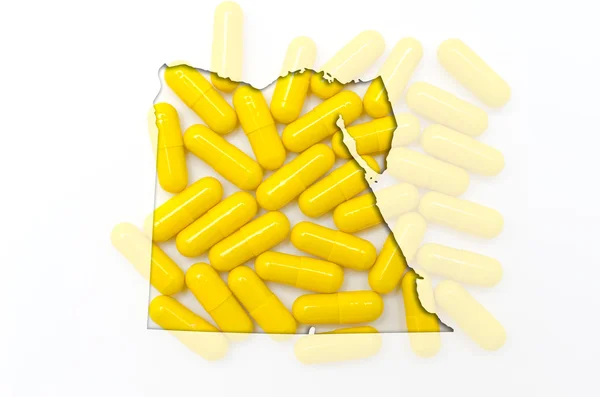 Mapa do contorno do egito com pílulas em segundo plano para a saúde e — Fotografia de Stock