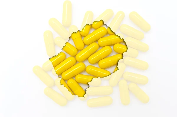 Umrisskarte von lesotho mit Pillen im Hintergrund für Gesundheit a — Stockfoto