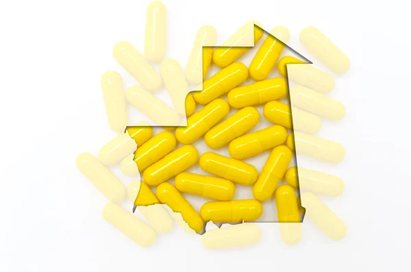 Outline map of mauritania with pills in the background for healt — Stock Photo, Image