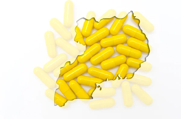 Schéma carte de uganda avec des pilules en arrière-plan pour la santé et — Photo