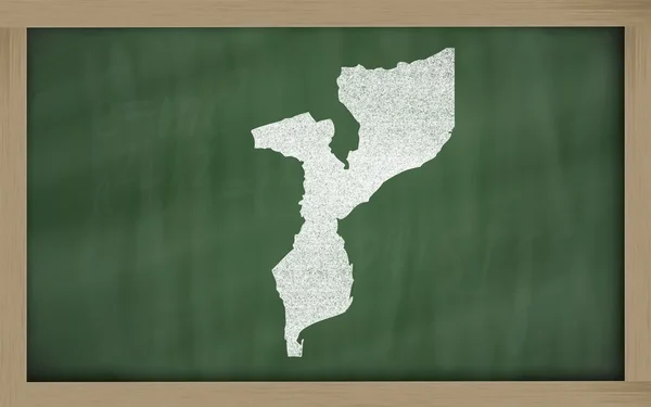 stock image Outline map of mozambique on blackboard