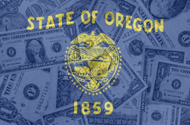 US state of oregon flag with transparent dollar banknotes in bac clipart