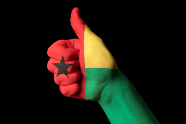Nationale vlag van Guinee bissau duim omhoog gebaar voor uitmuntendheid en — Stockfoto