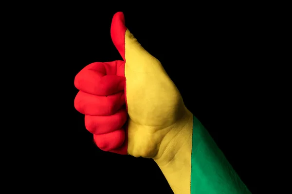 Bandiera nazionale della Guinea pollice in su gesto per l'eccellenza e raggiungere — Foto Stock