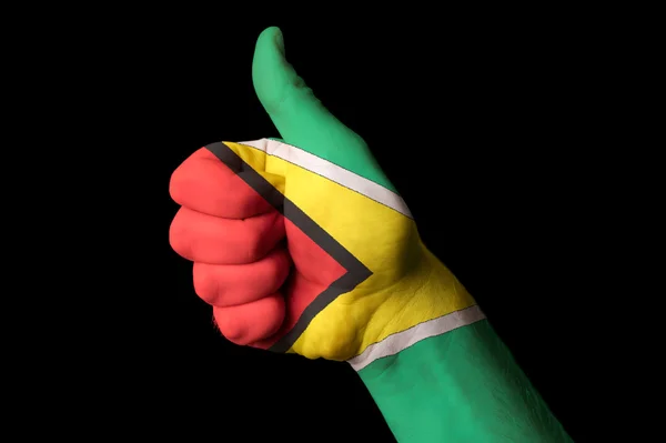 Guyana national flag thumb up gesture for excellence and achieve — Stock Photo, Image