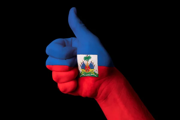 Národní vlajka Haiti s prstem gesto pro vynikající výsledky a úspěchy: — Stock fotografie