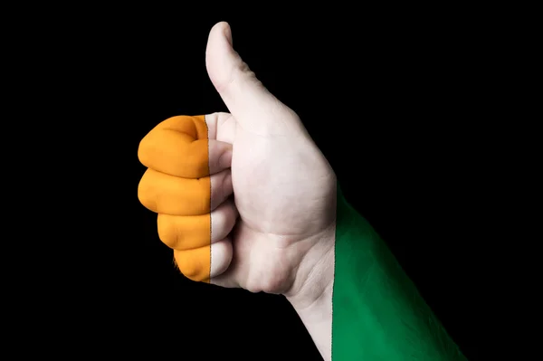 Ivory coast national flag thumb up gesture for excellence and ac — Stock Photo, Image