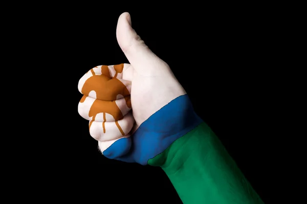 Lesothos flagga tummen upp gest för excellence och UNI — Stockfoto