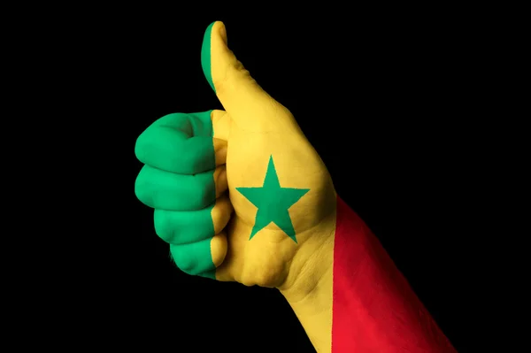 Flaga Senegalu kciukiem do góry gest do doskonałości i achiev — Zdjęcie stockowe
