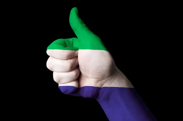 Sierra leone zászlaja hüvelykujját, gesztus, a kiválóság és a — Stock Fotó
