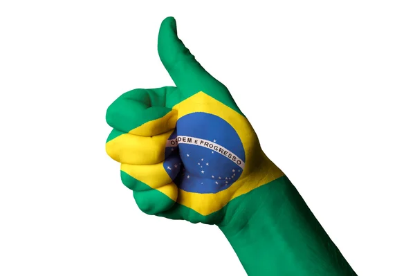 巴西国旗拇指向上卓越的姿态，并实现 — 图库照片
