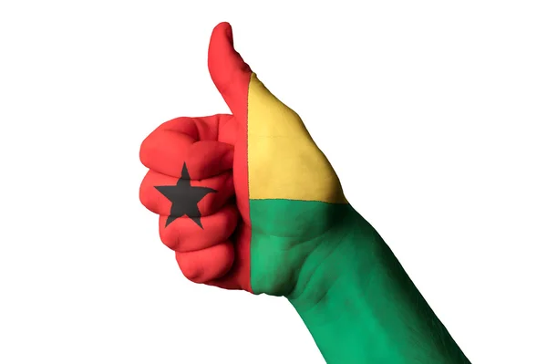 Guinea Bissaus flagga tummen upp gest för kvalitet och — Stockfoto
