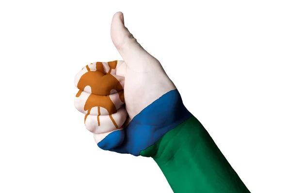 Lesotho national flag thumb up gesture for excellence and achiev — Stock Photo, Image
