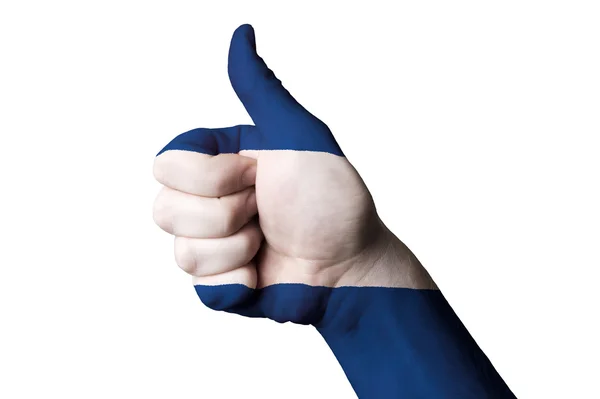 Nicaragua national flag thumb up gesture for excellence and achi — Stock Photo, Image