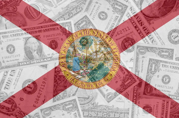 Drapeau de l "État de Floride avec billets en dollars transparents en ba — Photo
