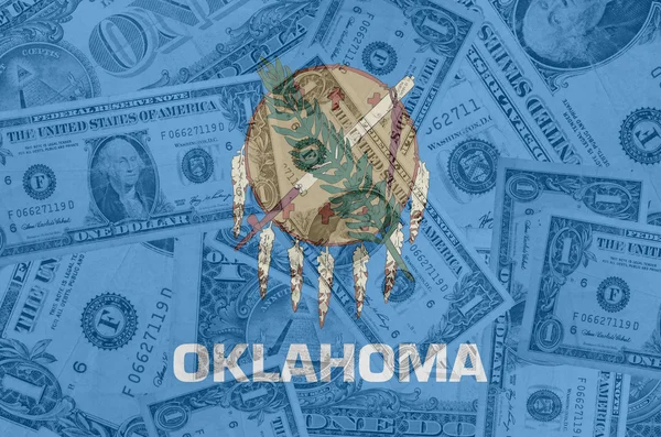 US state of oklahoma flag with transparent dollar banknotes in b — Stock Photo, Image