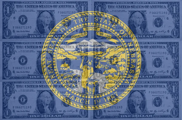我们内布拉斯加州旗子与 b 中的透明港元钞票。 — 图库照片