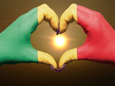 Heart and love gesture by hands colored in mali flag during beau clipart