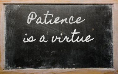 Expression - Patience is a virtue - written on a school blackbo clipart