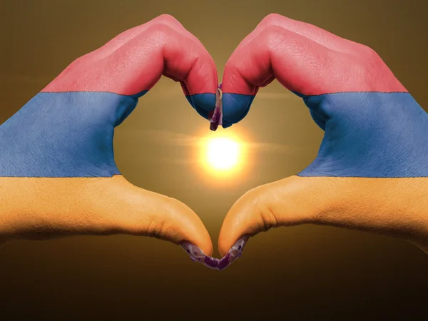 Heart and love gesture by hands colored in armenia flag during b — Stock Photo, Image