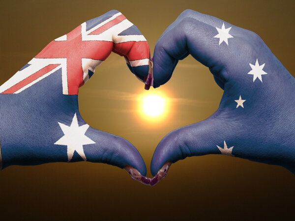 Heart and love gesture by hands colored in australia flag during