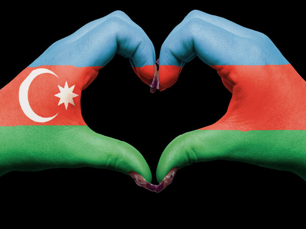 Heart and love gesture by hands colored in azerbaijan flag for t