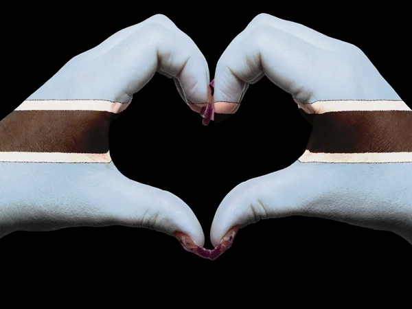 Hjärta och kärlek gest av händer färgade i botswana flagga för att — Stockfoto