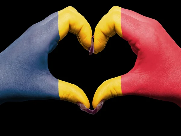 stock image Heart and love gesture by hands colored in chad flag for touris