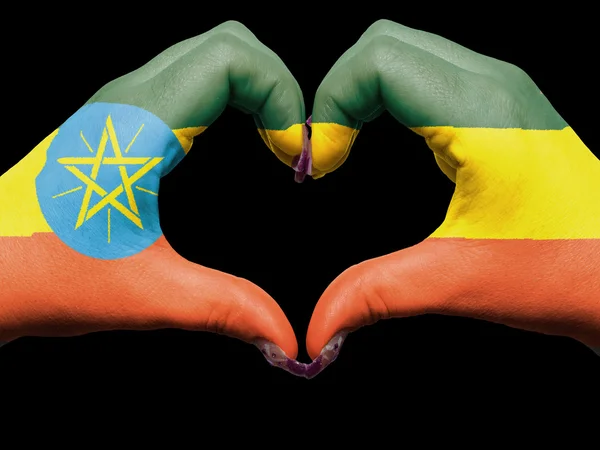 Heart and love gesture by hands colored in ethiopia flag for tou — Stock Photo, Image