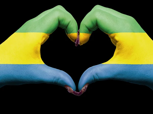 Heart and love gesture by hands colored in gabon flag for touri — Stock Photo, Image