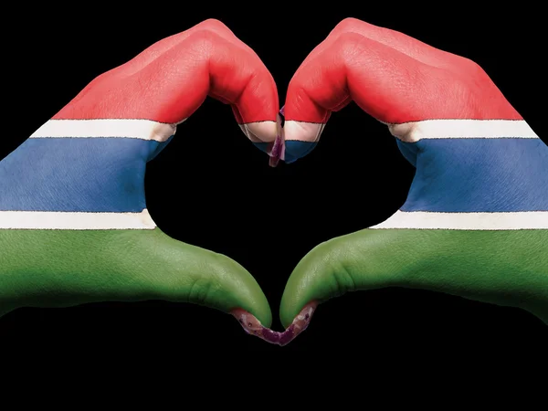 Szív és a szeretet gesztusa, kezében színes gambia zászló, amely a — Stock Fotó
