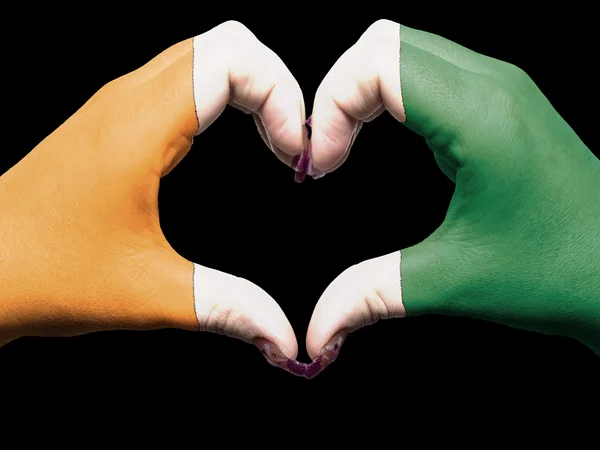 Heart and love gesture by hands colored in ivory coast flag for — Stock Photo, Image