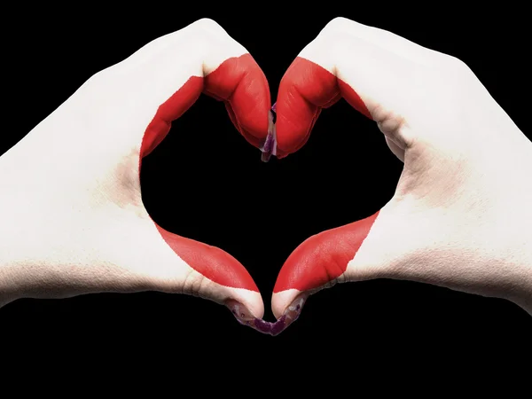 Hjärta och kärlek gest av händer färgade i japan flagga för touri — Stockfoto
