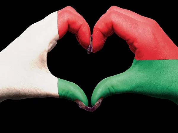 Hart en liefde gebaar door handen gekleurde in Madagaskar vlag voor Engelse vertaling — Stockfoto