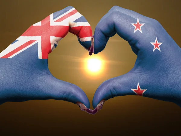 Heart and love gesture by hands colored in new zealand flag duri — Stock Photo, Image