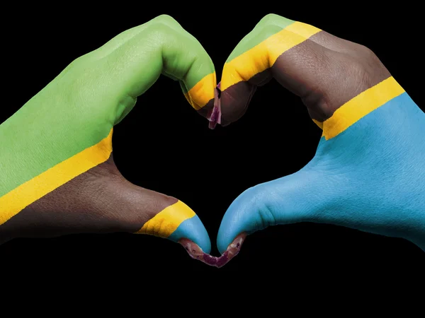 Tou のタンザニアの国旗の色の心と愛のジェスチャーの手で — ストック写真