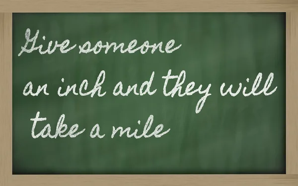 Expression - Give someone an inch and they will take a mile - w — 图库照片
