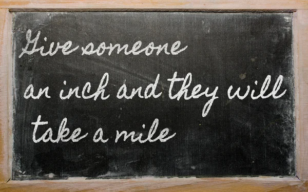 Expression - Give someone an inch and they will take a mile - w — Stockfoto