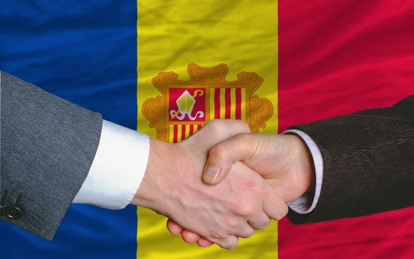 Businessmen handshake after good deal in front of andora flag — Stock Photo, Image
