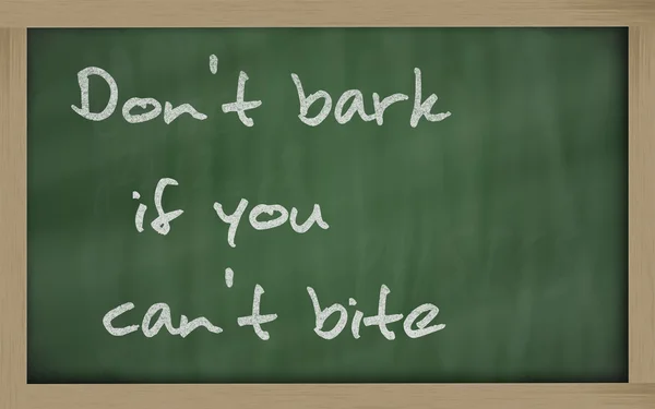 " Don't bark if you can't bite " written on a blackboar — Stock Photo, Image