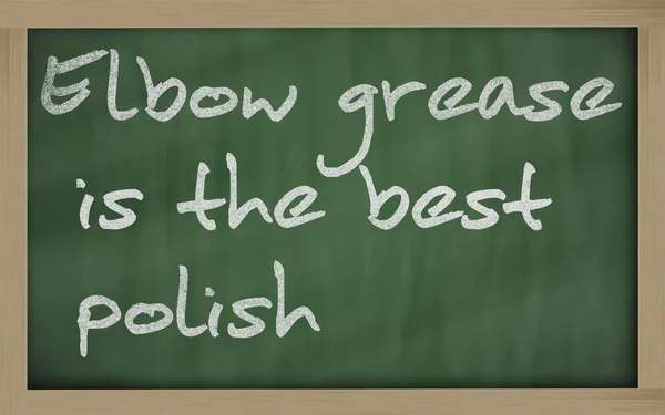 " Elbow grease is the best polish "written on a blackboard — стоковое фото