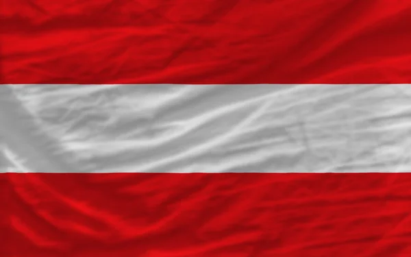 完成挥手的国旗，奥地利为背景 — 图库照片
