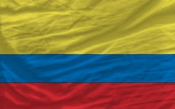 Kompletny kiwał flagi narodowej Kolumbii na tle — Zdjęcie stockowe