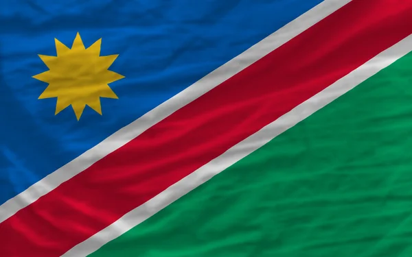 Полный размахивал национальным флагом Намибии на заднем плане — стоковое фото