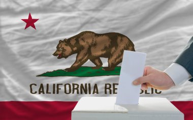 Man voting on elections in front of flag US state flag of califo clipart