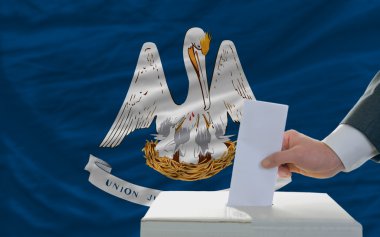Man voting on elections in front of flag US state flag of louisi clipart