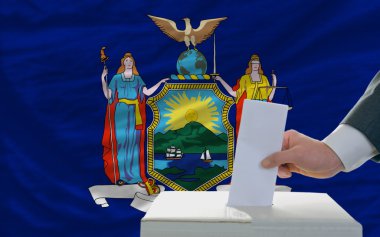 Man voting on elections in front of flag US state flag of new yo clipart