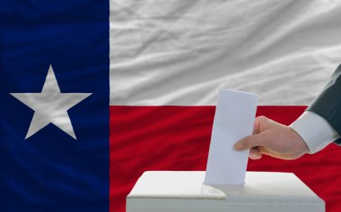 Man voting on elections in front of flag US state flag of texas clipart
