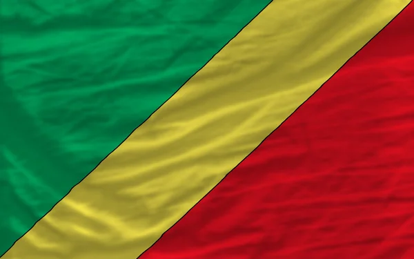 Полный размахивал национальным флагом Конго на заднем плане — стоковое фото
