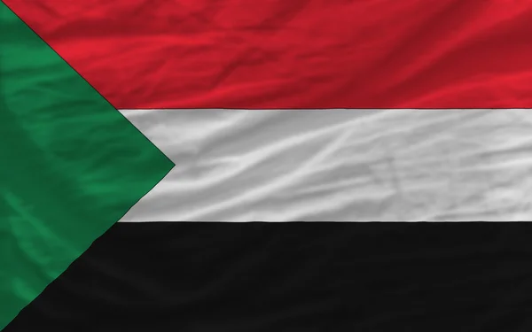 Komplett geschwenkte Nationalflagge des Sudans als Hintergrund — Stockfoto